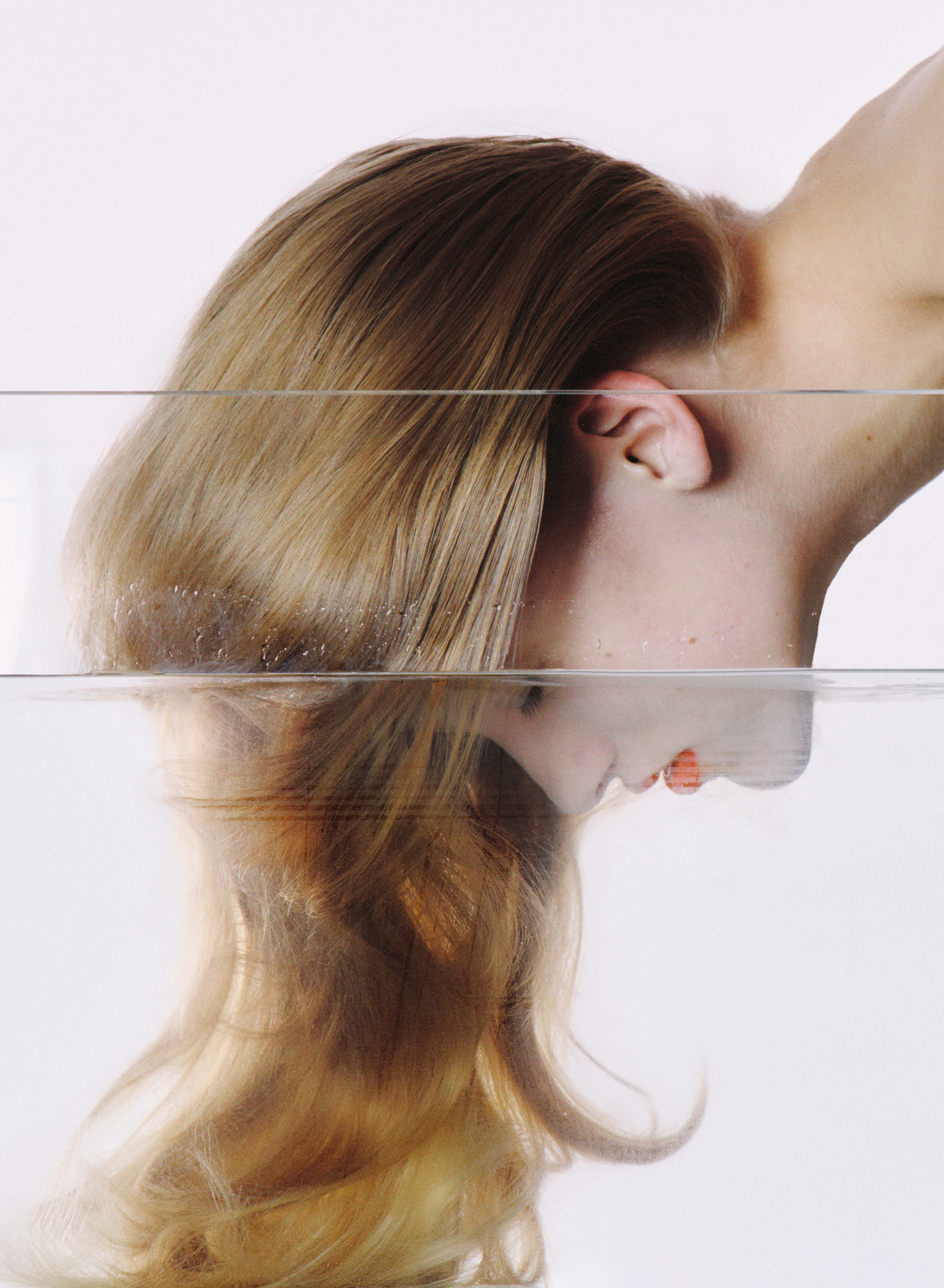 Image of woman dunking head in water
