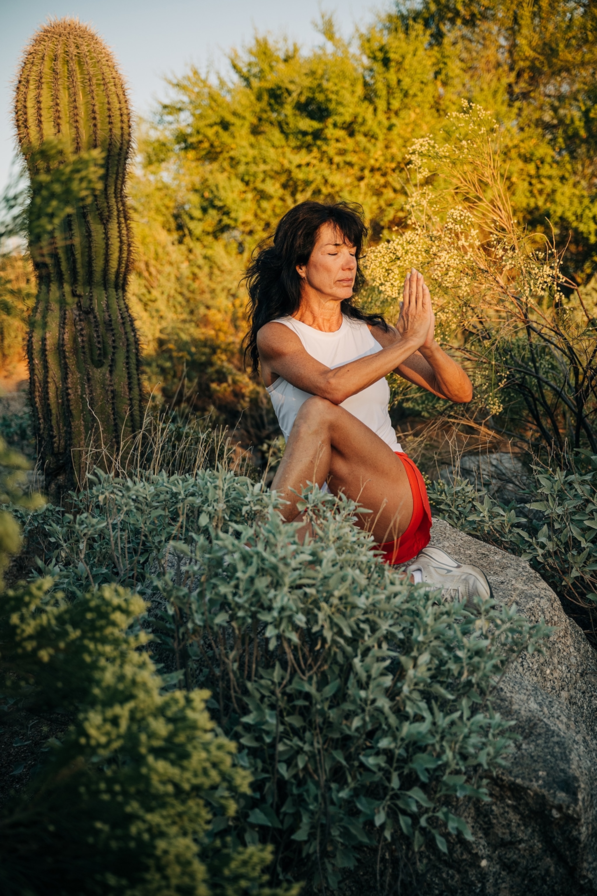 Yoga instructor posing in the desert