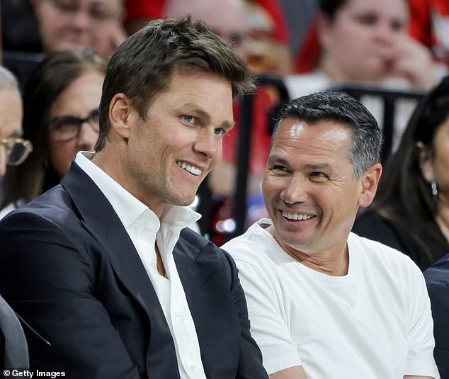 Raiders players are becoming frustrated with Tom Brady confidant Alex Guerrero (right)