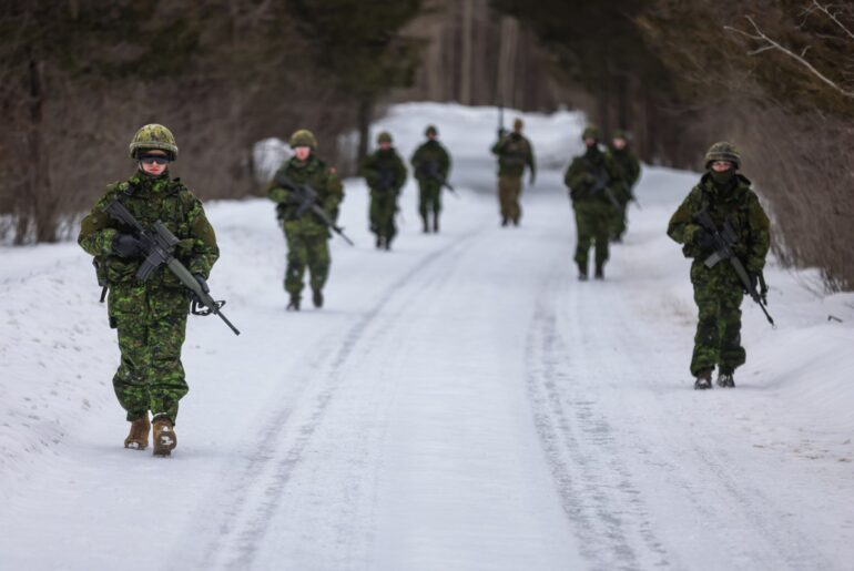 Canadian Army reservists conducting roadside fitness marches in northern Ontario