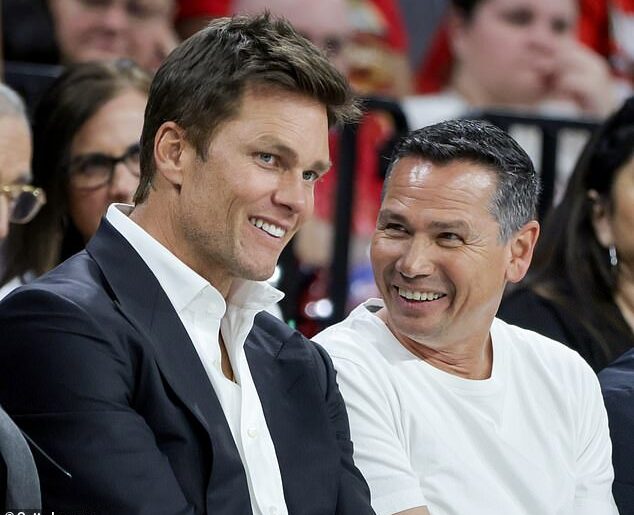 Raiders players are becoming frustrated with Tom Brady confidant Alex Guerrero (right)