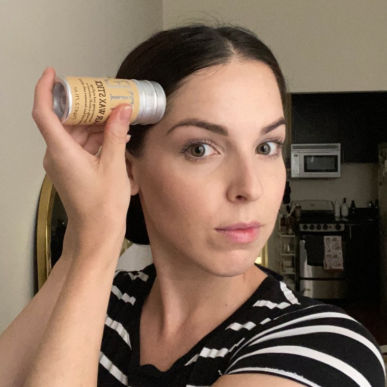 Applying the Samnyte Hair Wax Stick.