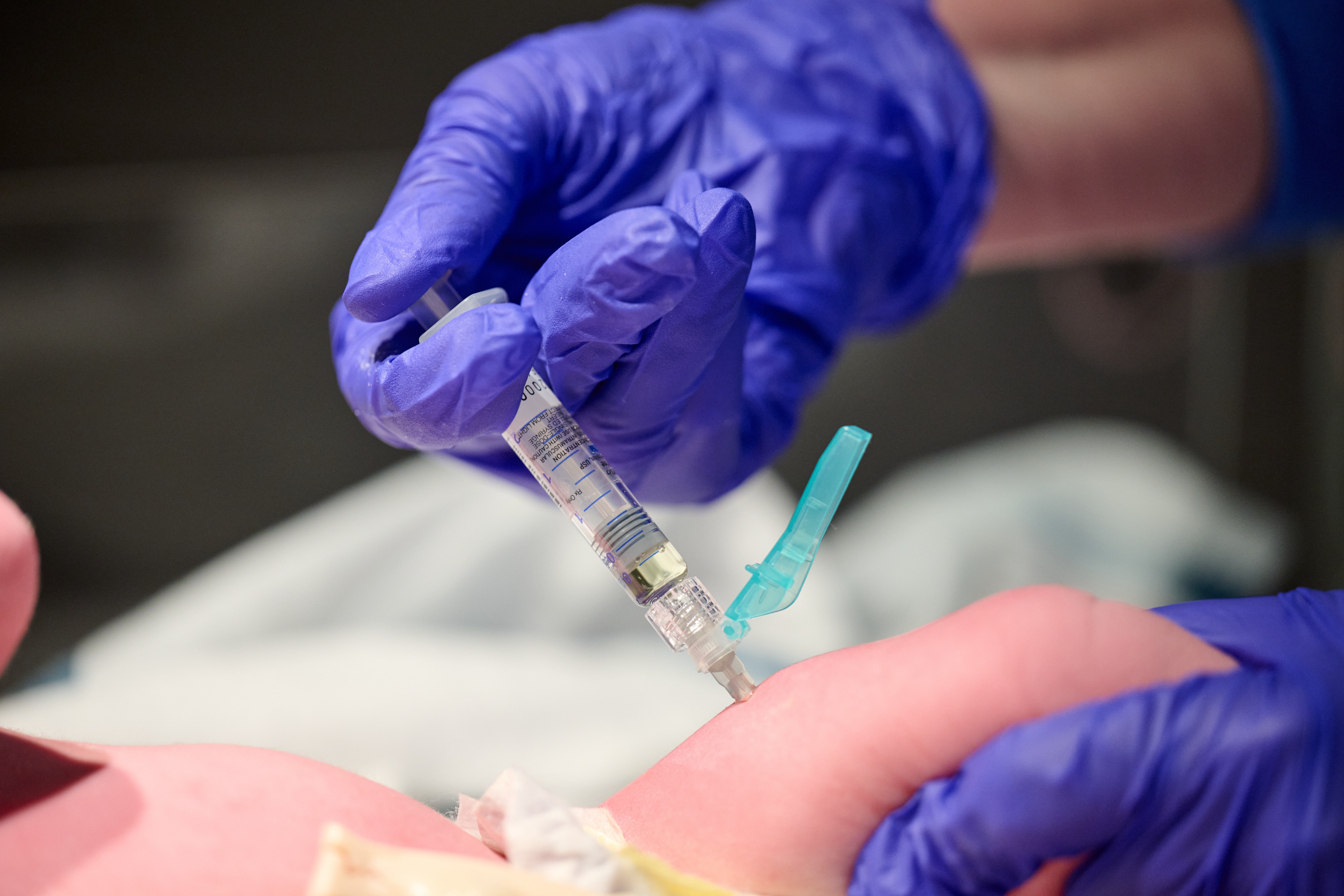 In this photo provided by Norton Healthcare, nurse Robin Waldridge administers a Vitamin K shot to a newborn baby at Norton Women's and Children's Hospital on Friday, March 6, 2026, at the hospital in Louisville, Ky. (Jamie Rhodes/Norton Healthcare via AP)