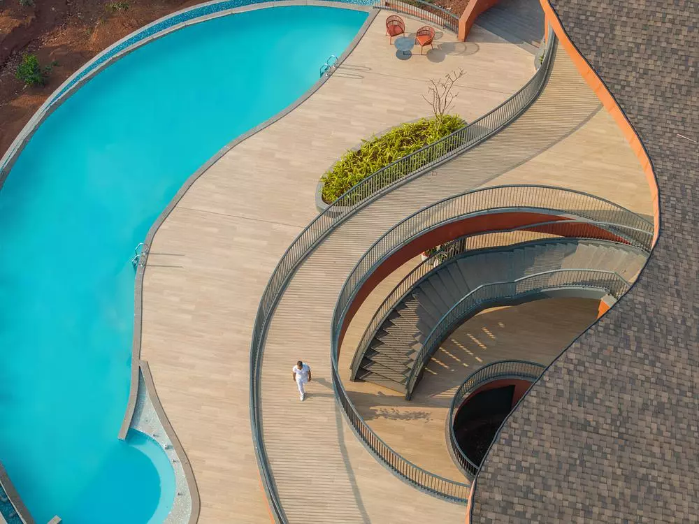 Three swimming pools, a health club, an open cafeteria, and a multifunctional deck are located on the lower level