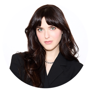 portrait in a circular frame featuring a person with long hair and a black outfit