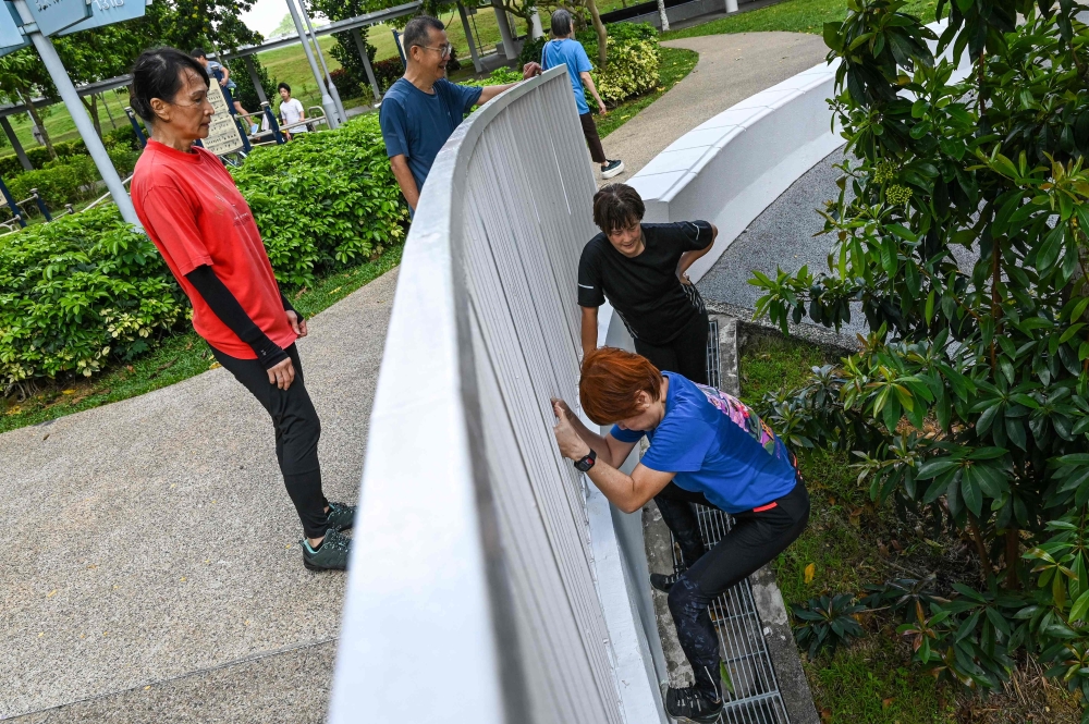 This photograph taken on March 17, 2026 shows Singaporean elders taking part in a parkour training session in Singapore. The discipline has gained a devoted following of senior citizens in the city-state, which is among the world’s fastest-ageing countries. — AFP pic 