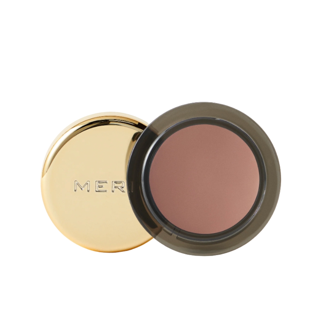 A product shot of the Merit Solo Shadow in the shade Studio (a soft taupe), on a white background