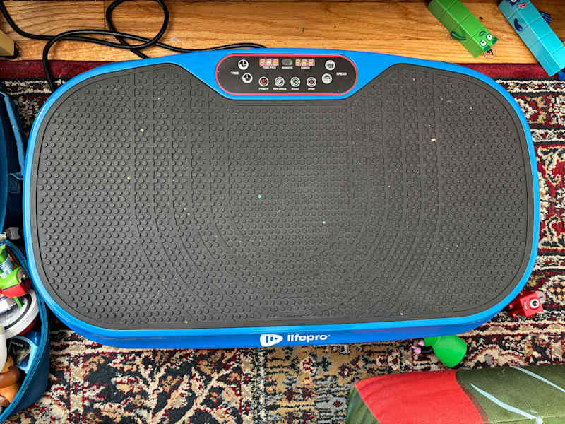 LifePro vibrating pad in living room.
