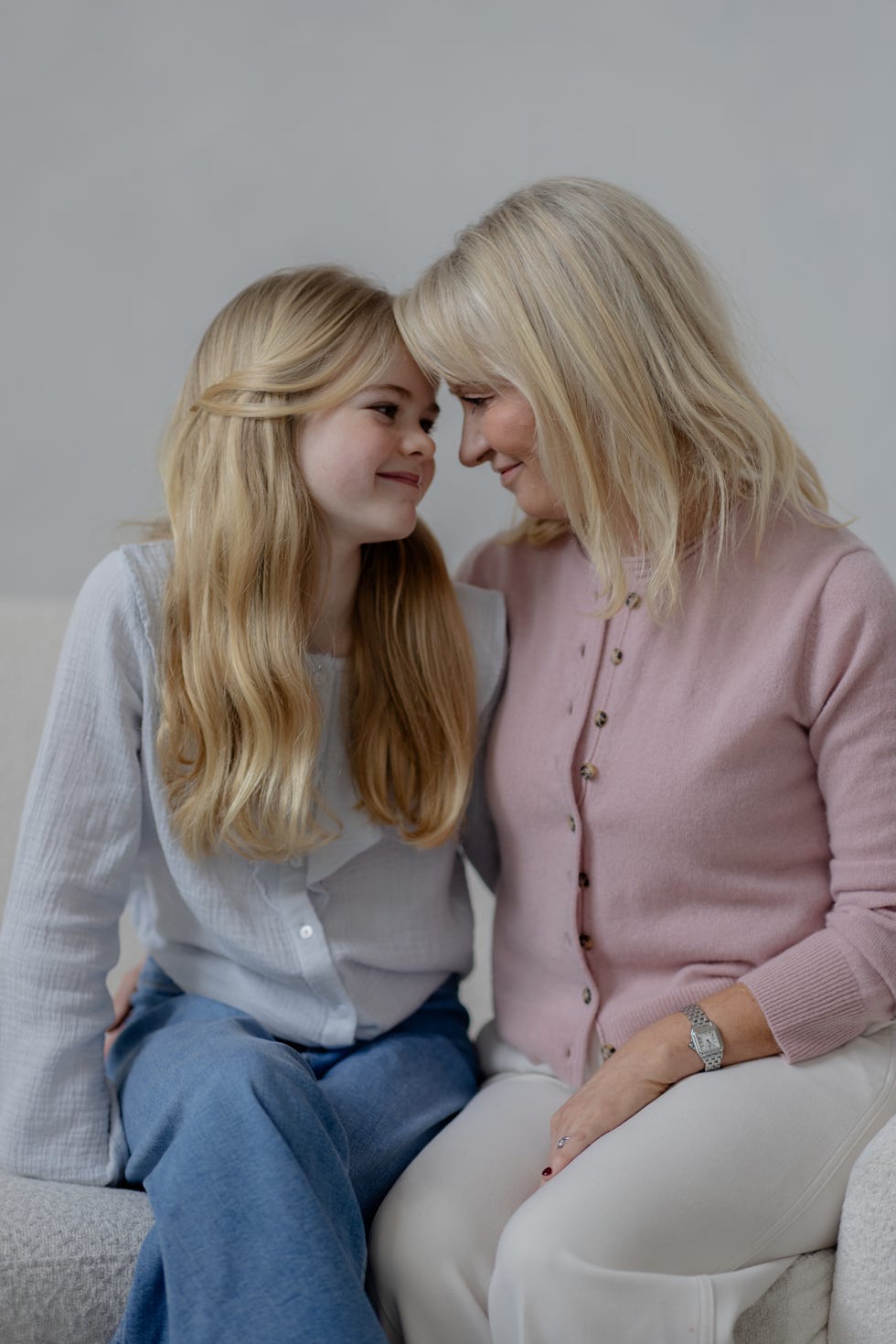 two individuals sitting close together sharing a moment of connection