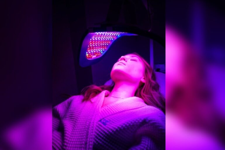 Image of a woman undergoing low-level light therapy treatment