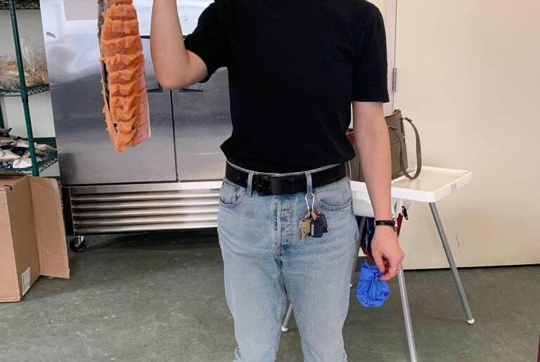 Tanat Whalen, the community nutrition specialist with the Department of Health, holds a dried char that would later become pitti, or dried fish. Photo courtesy Tanat Whalen