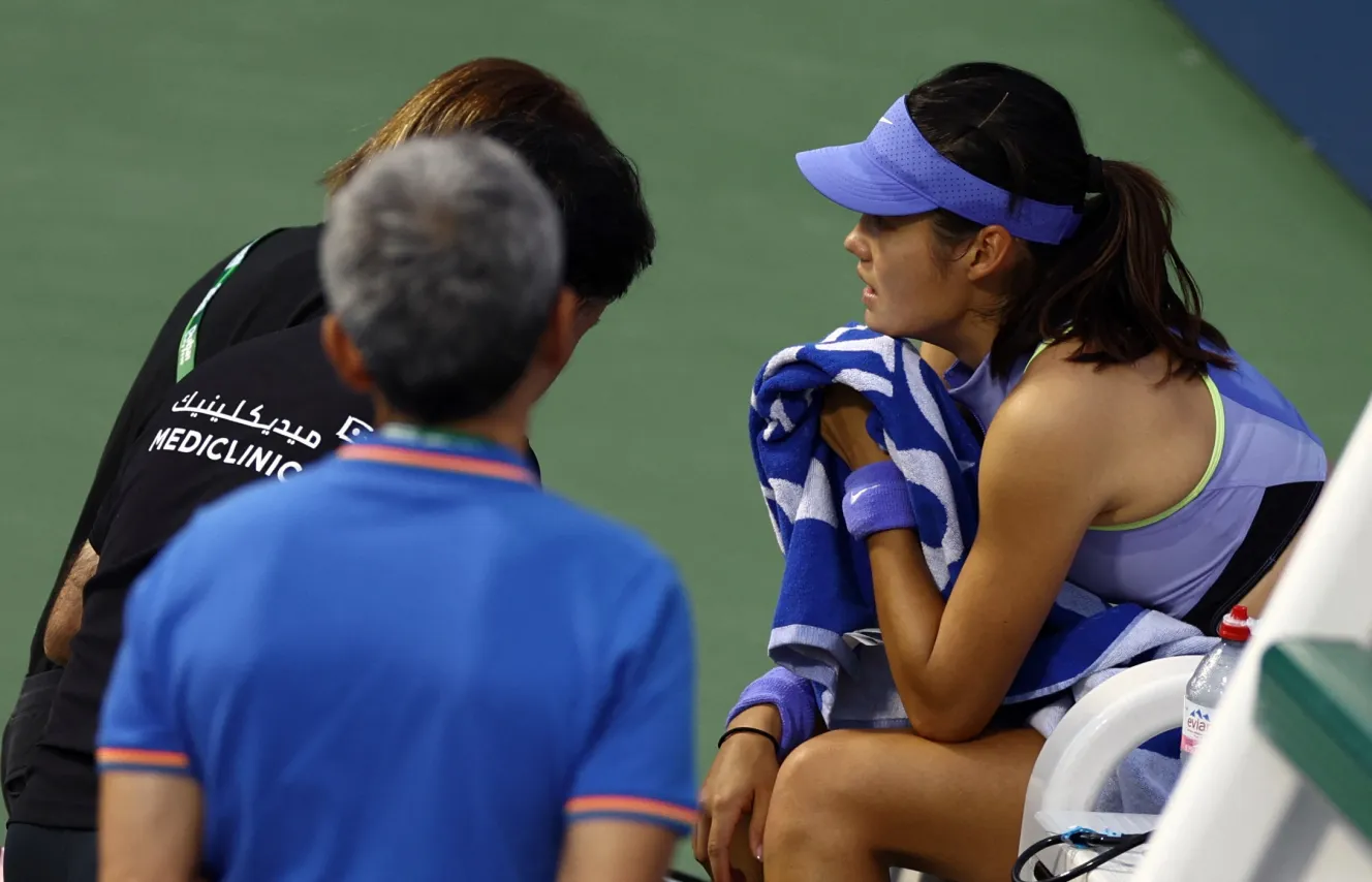 Britain's Emma Raducanu receives medical attention during her round of 64 match against Croatia's Antonia Ruzic at the WTA 1000 - Dubai Championships.
