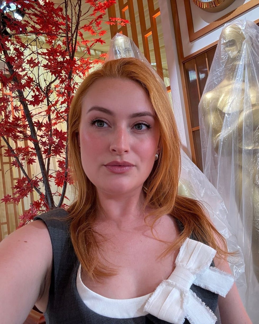 Selfie featuring a person in a stylized setting with decorative elements. Selfie featuring a person in a stylized setting with decorative elements.