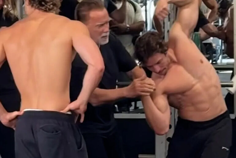 Heart-warming moment Arnold Schwarzenegger teaches fitness model son to pose