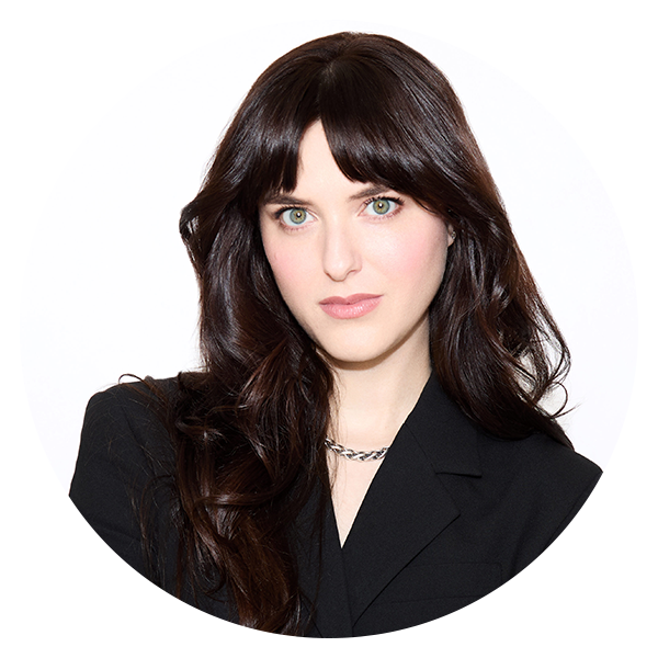 portrait in a circular frame featuring a person with long hair and a black outfit