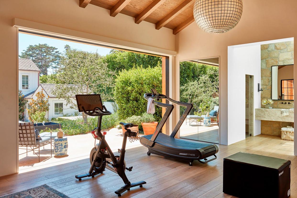 Home gym with fitness equipment and open view.