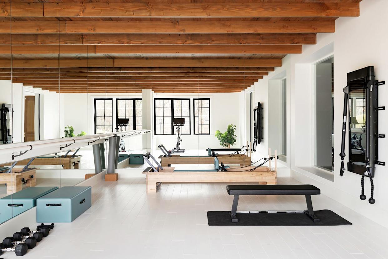lower level gym. mirrors installed floor to ceiling across two walls make this room by lauren buxbaum gordon of nate berkus associates seem double the size—and brighter. peterssen keller architecture + hnh homes + nate berkus associates 5200 dundee rd, edina, mn 55436