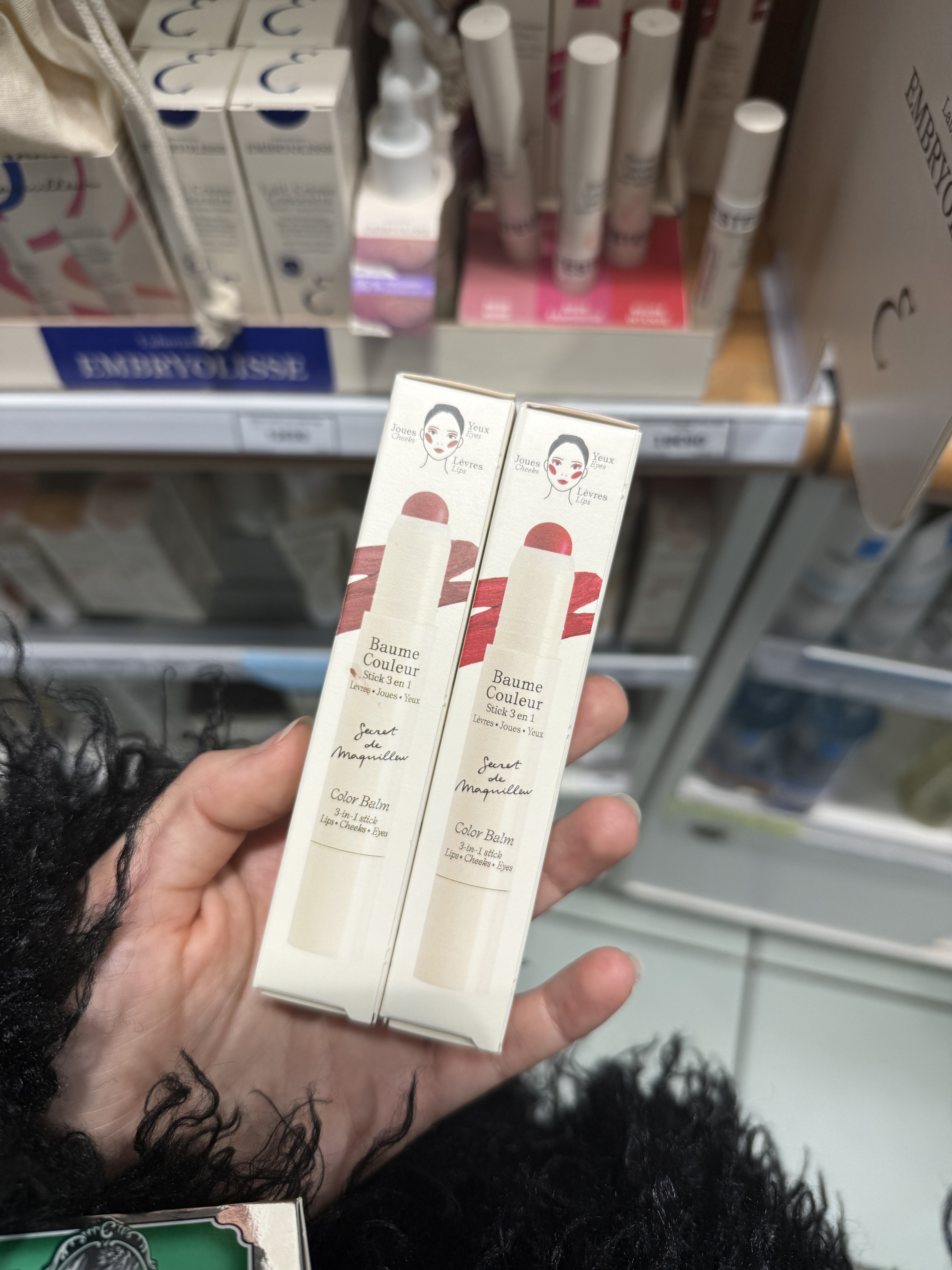 Photo of Jamie Schneider shopping for Embryolisse's color balms