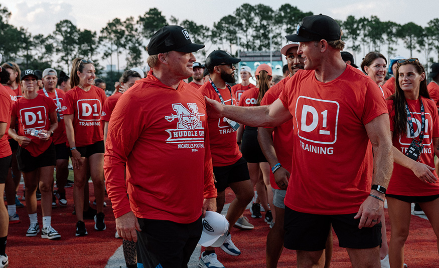 D1 Training CEO Will Bartholomew (right) with Jon Gruden
