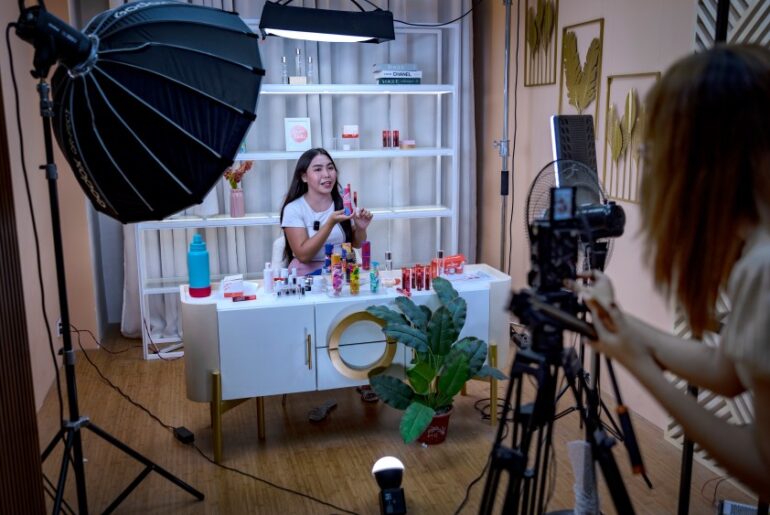 PULILAN, PHILIPPINES - JUNE 26: A live host promotes products for a skincare brand on a TikTok Shop livestream at one of the studios of Ownline Marketing on June 26, 2024 in Pulilan, Bulacan province, Philippines. Ownline Marketing, an agency that specializes in marketing brands on TikTok Shop and other e-commerce platforms, began only early this year with just one client but has quickly expanded to serving more than a dozen local and foreign brands, operating full production studios and delivering slick livestreams reminiscent of television home shopping channels. TikTok Shop, the e-commerce platform within the popular short video app, has spurred a booming live selling industry in the Philippines, where businesses are benefiting from TikTok's prized algorithm to sell more and faster, disrupting the market for other established e-commerce platforms in the region. However, a proposed bill in the Philippine Congress, House Bill 10489, introduced amid geopolitical tensions with China and following similar moves by other countries, aims to ban "foreign adversary-controlled" apps, likely targeting TikTok and could threaten the livelihoods of many Filipinos who have built their businesses on the platform​​​​. (Photo by Ezra Acayan/Getty Images)