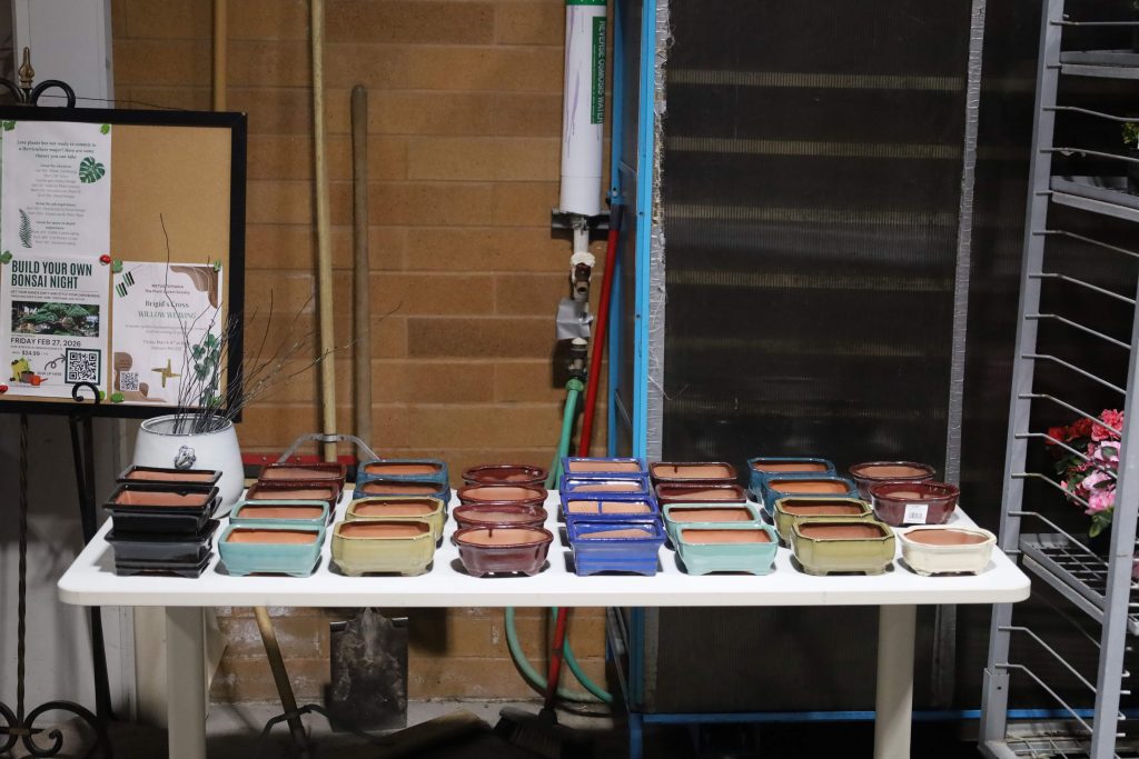 Pots sit on a table.