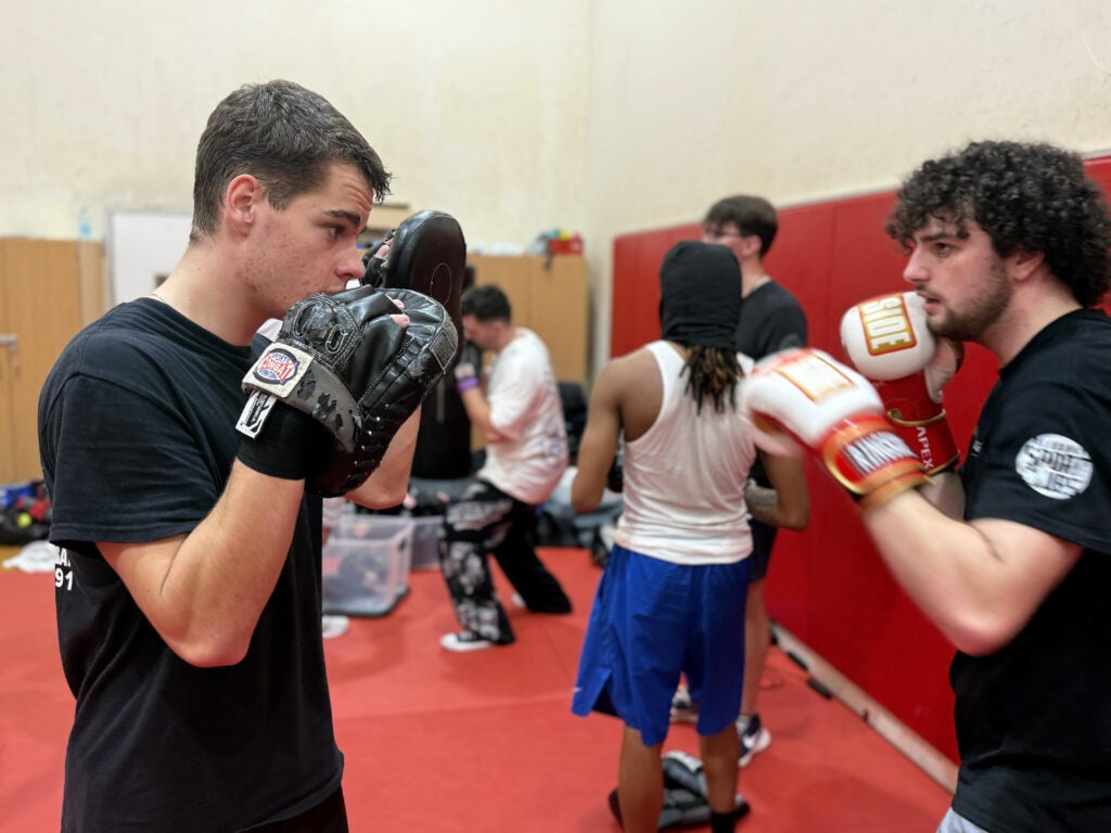 boxers practice in the gym