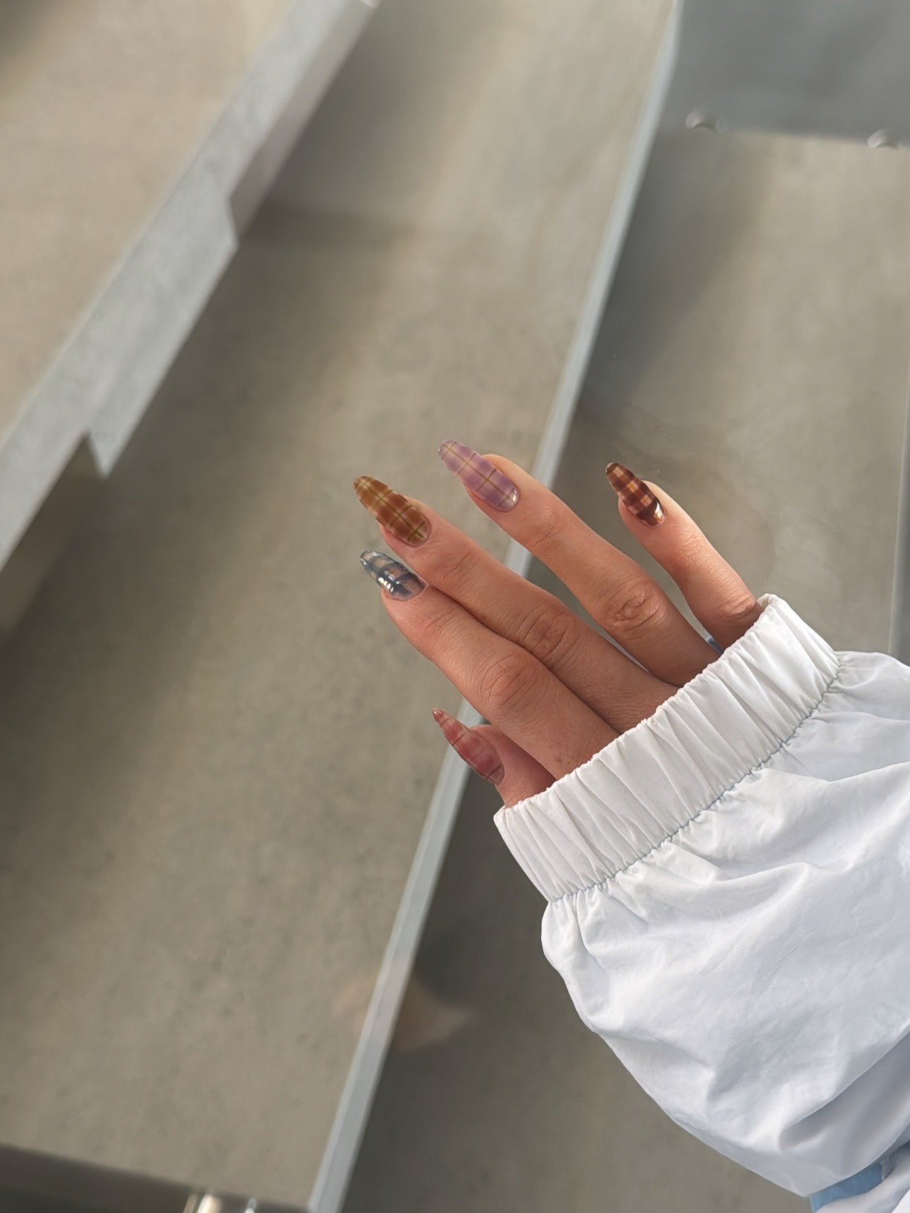 An image of Kylie Jenner's plaid nails.