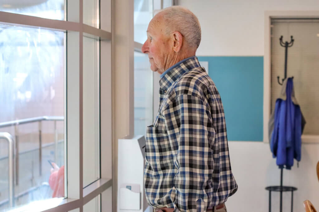 Funkhouser looks out at the pool in the Beede Swim and Fitness Center. Photo: Trace Salzbrenner/Concord Bridge