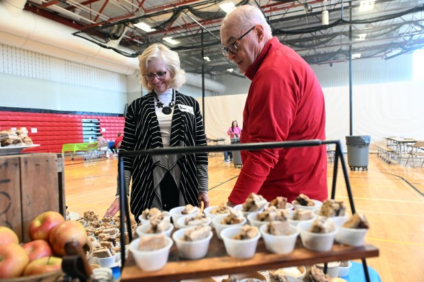 Jayne and Tom McHugh of Boyertown check out the entries in the Kids Celebrity Chef contest during the Wellness Council of Boyertown's 19th annual Wellness Fair at the Boyertown Area Senior High School on Saturday, March 14, 2026.(BILL UHRICH/READING EAGLE)