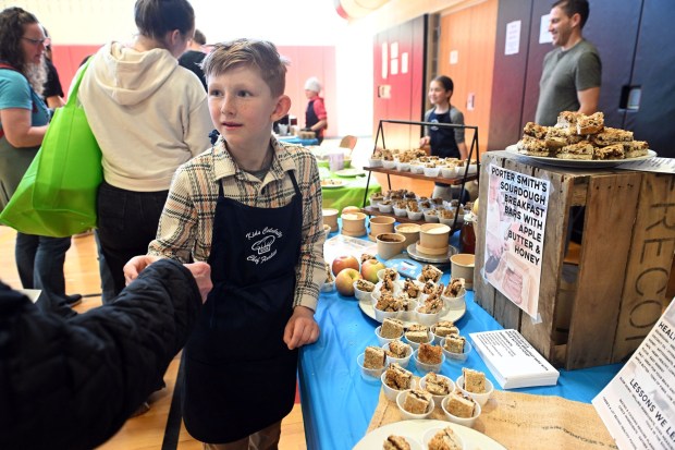 Porter Smith, 9, a fourth grader at Earl Elementary, hands out samples of his sourdough breakfast bar with apple butter and honey during the Wellness Council of Boyertown's 19th annual Wellness Fair at the Boyertown Area Senior High School on Saturday, March 14, 2026.(BILL UHRICH/READING EAGLE)