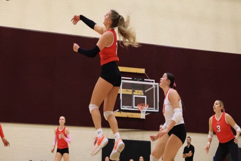 "Sis" Stouffer helps Miners at away, varsity volleyball tournament.