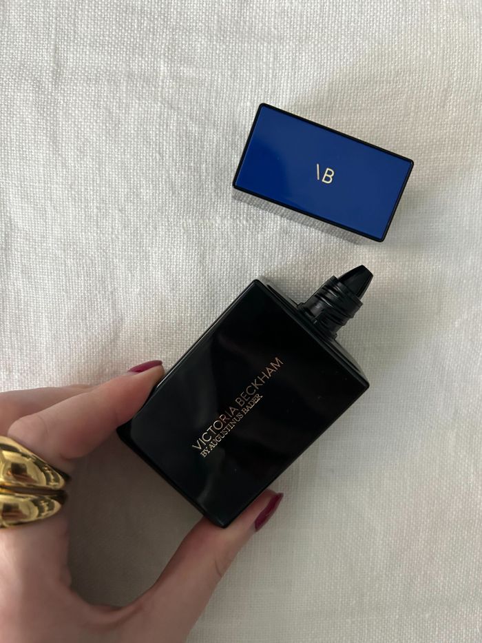 Deputy beauty editor Grace Lindsay holding the Victoria Beckham by Augustinus Bader The Foundation Drops with TFC8®