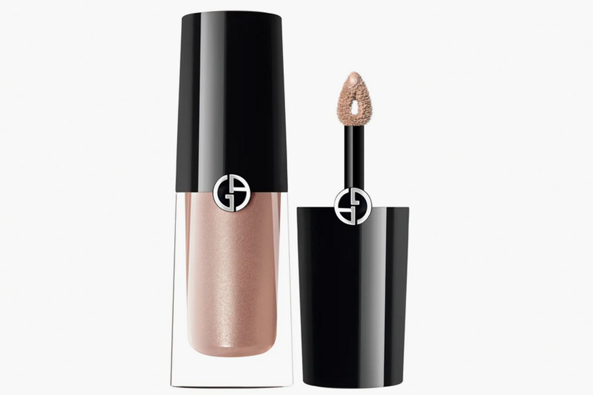 An open tube of liquid eyeshadow with a black cap and applicator next to a closed tube of the same eyeshadow.