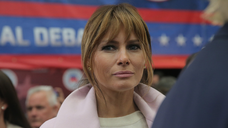 Melania Trump, wife of presidential candidate Donald Trump, listens to her husband speak to the media in the spin room after the CNBC Republican Presidential Debate at University of Colorado's Coors Events Center October 28, 2015 in Boulder, Colorado