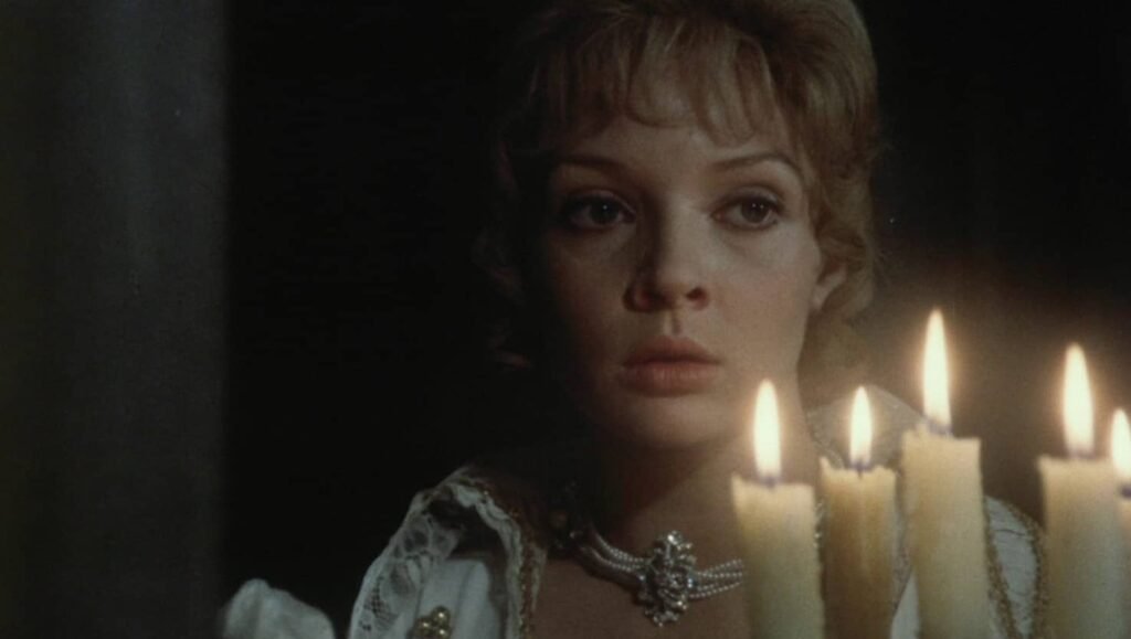 Still from Juraj Herz's Beauty and the Beast film, featuring the beauty with candles, highlighting themes of otherness.