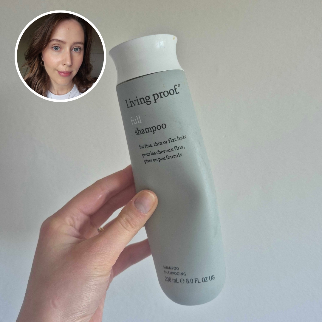 Hand holding an empty grey bottle of Living Proof Full Shampoo, with circular photo of Naomi Jamieson in top left corner