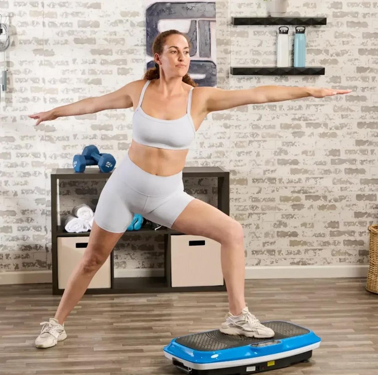 Person performing a balance exercise on a fitness platform.