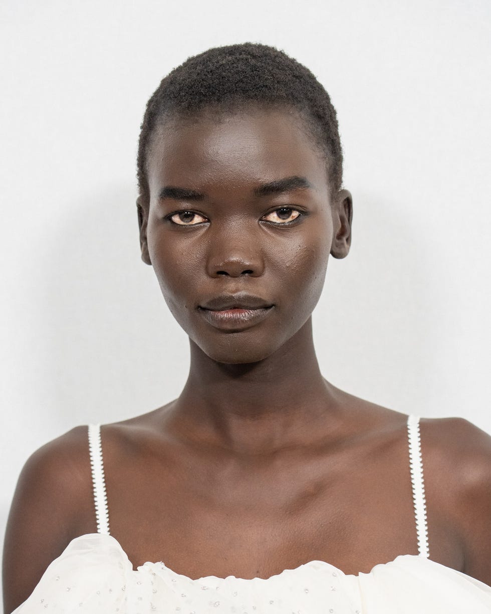 model wearing a white dress