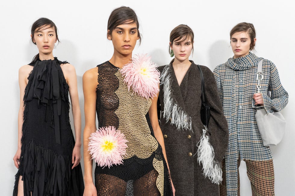 fashion models showcasing unique clothing designs at a fashion event