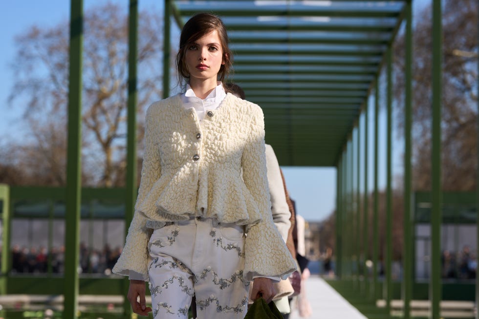 fashion model walking on runway during a show