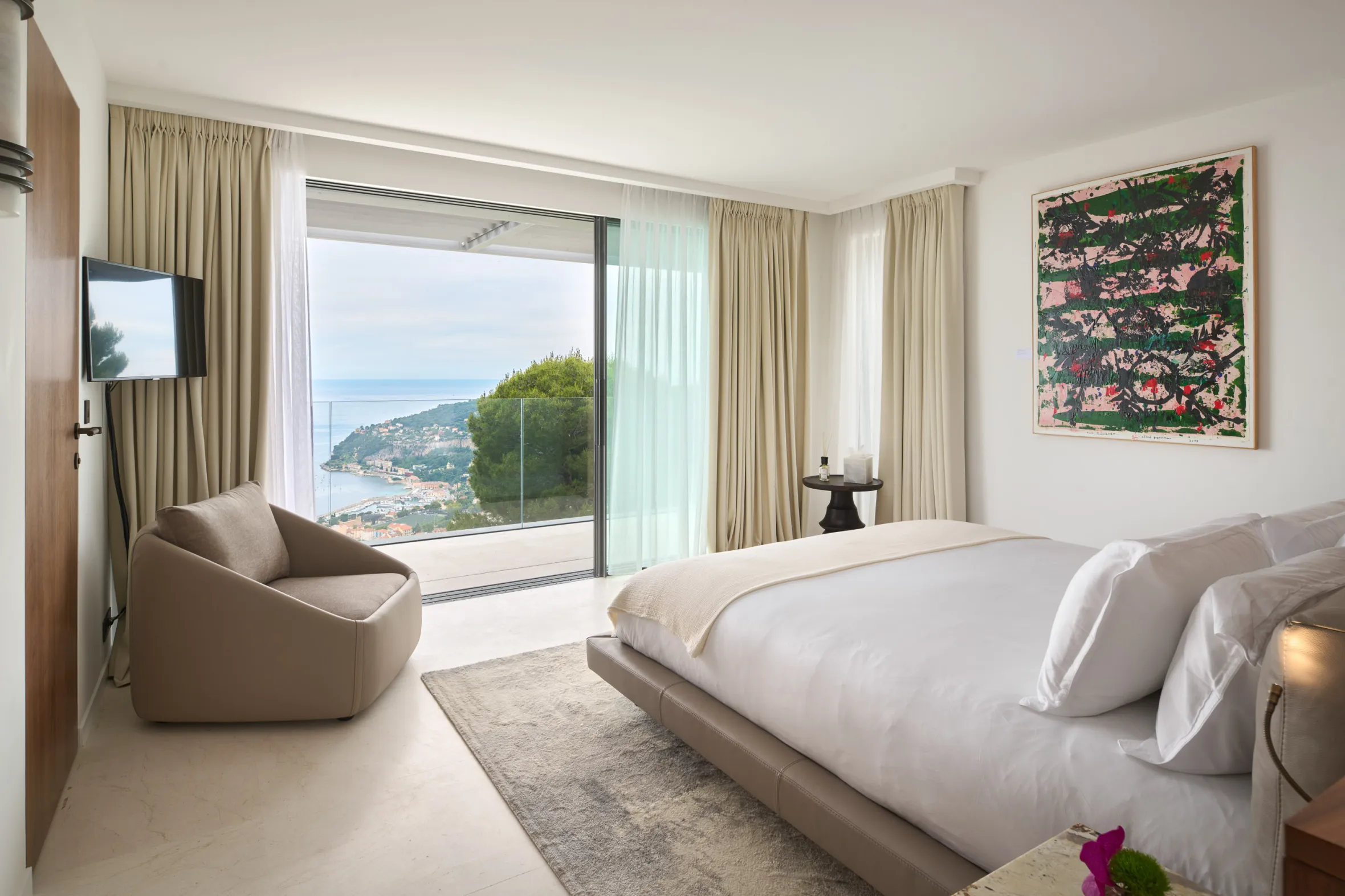 Bedroom with a view of the sea and coastline.
