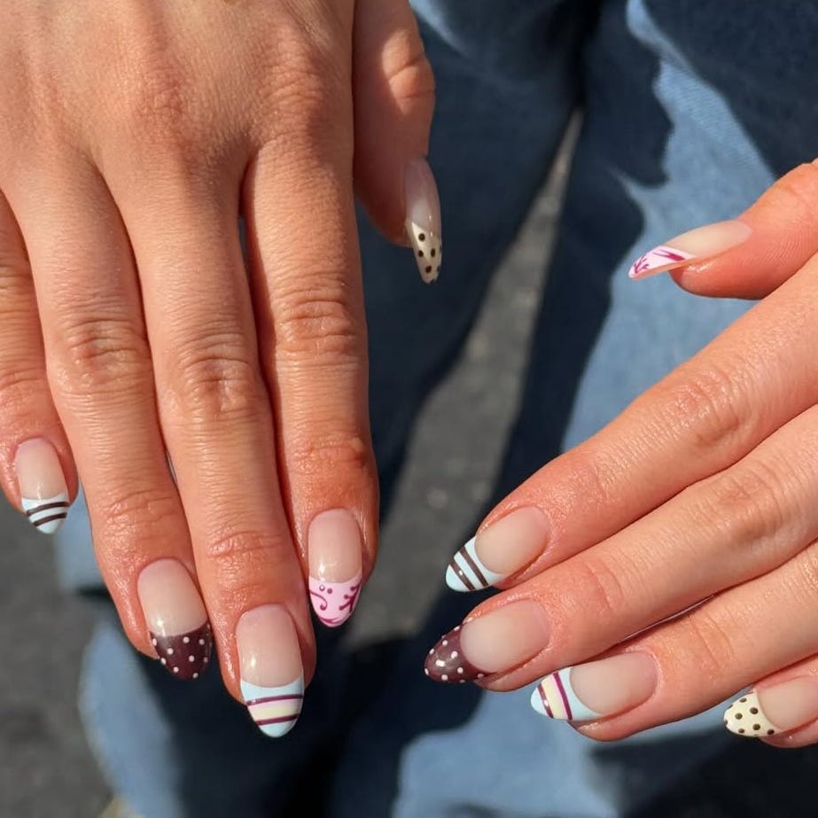 Nail art showcasing colorful designs on manicured nails.