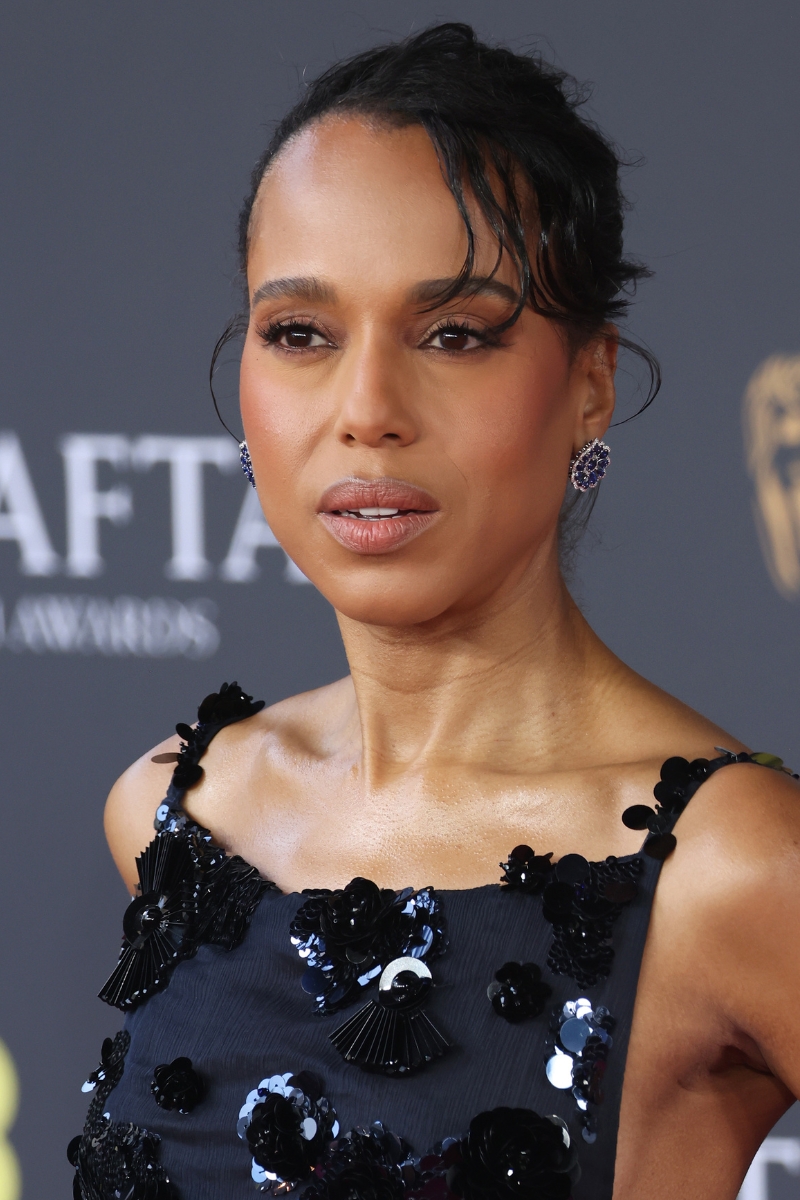 Kerry Washington is pictured with brown eyeshadow and wearing a navy dress, with sequin flower embellishments, at the 2026 EE BAFTA Film Awards at The Royal Festival Hall on February 22, 2026 in London, England.