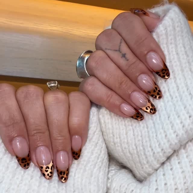 Nail art featuring a leopard print design.