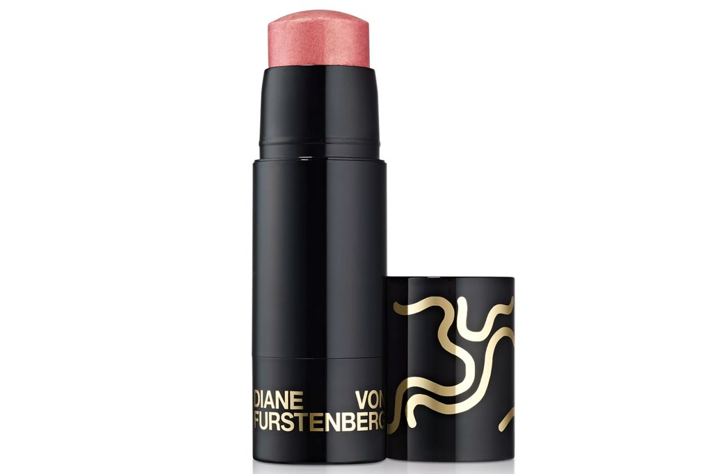 Diane Von Furstenberg blush stick in rose gold, with the cap off.