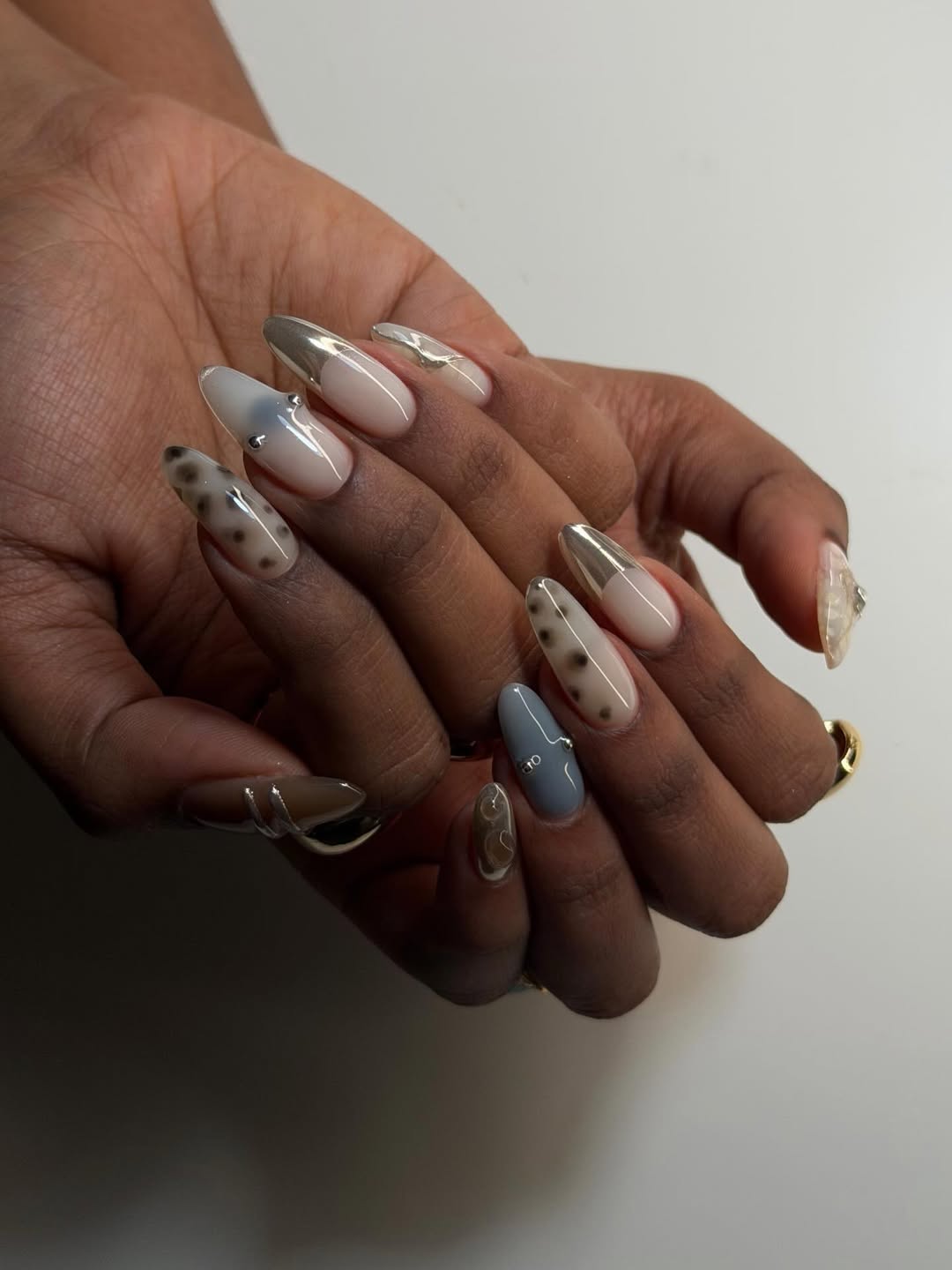 Mismatched manicure by Oksana Zavora