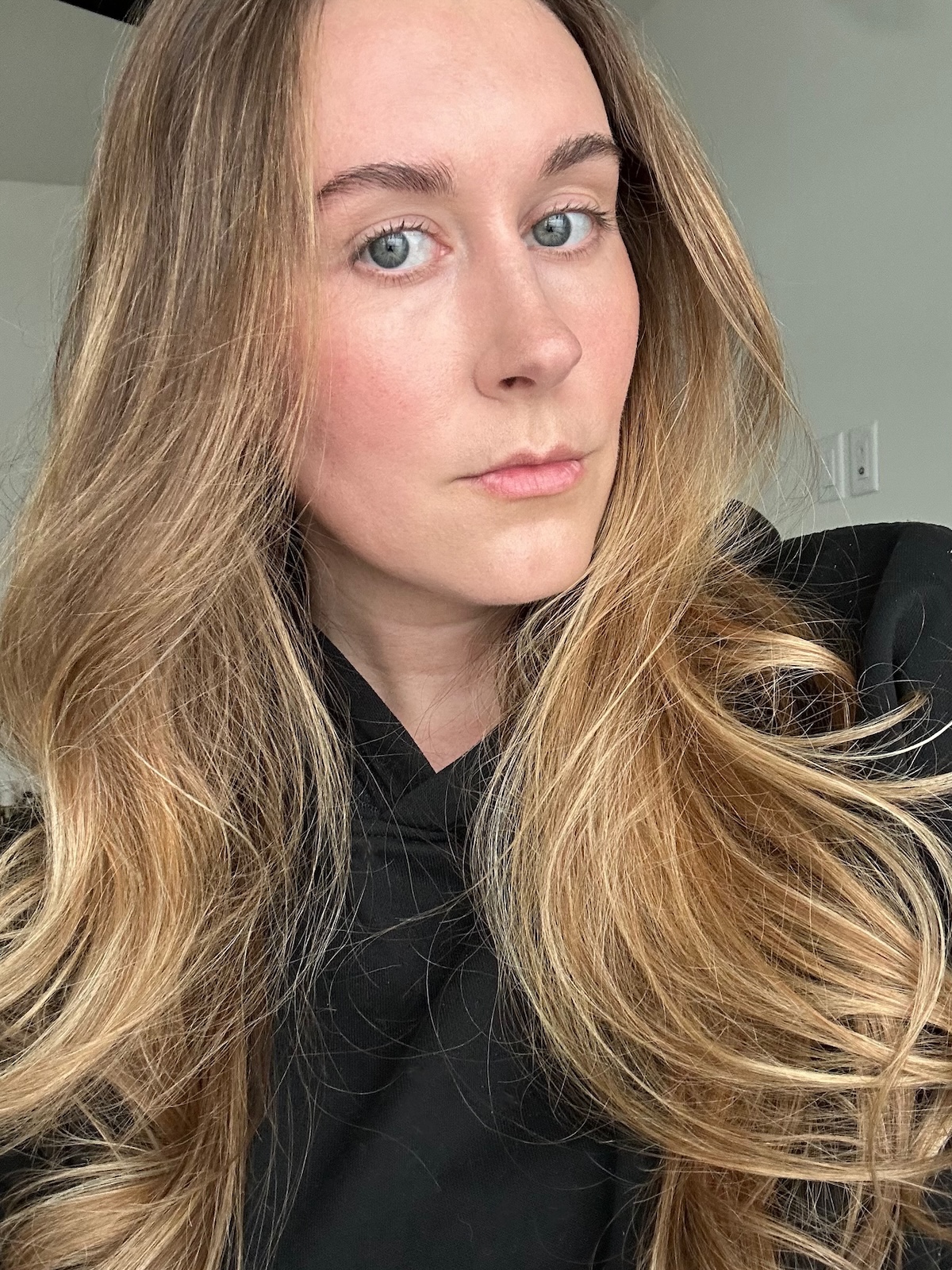 Beauty editor Kaitlyn McLintock after applying Hermès Plein Air Luminous Matte Skincare Foundation