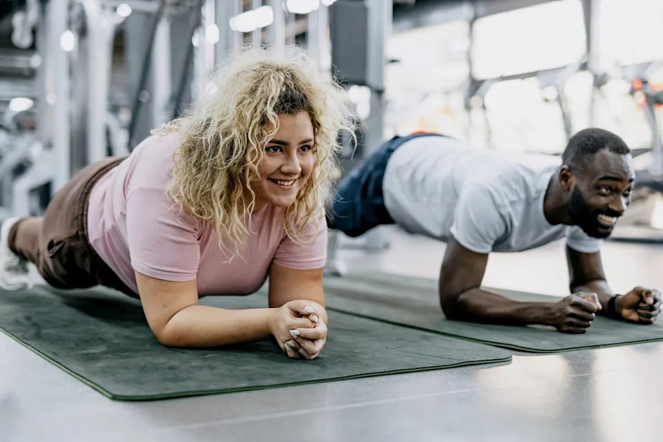 Two friends engage planking (Getty/iStock)