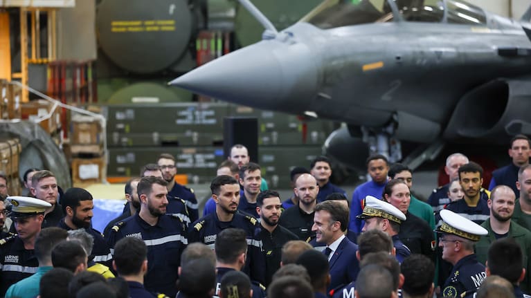 French President Emmanuel Macron meets the crew as he visits the French aircraft carrier Charles de Gaulle, during his visit to Cyprus, Monday March 9, 2026. 