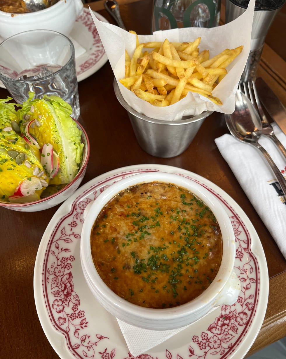 a meal featuring french fries a baked dish and a salad girl powder retreat review